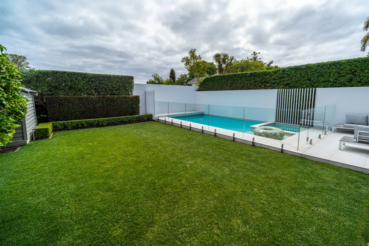 A freshly designed and planted garden bed with a crisp edge, by Urban Leaf Landscaping